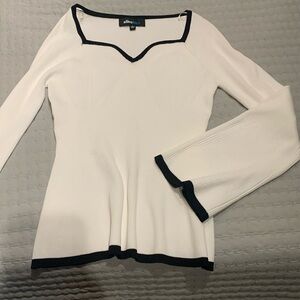 Alice blue- white shirt with black edges, sweetheart neckline, bell sleeves